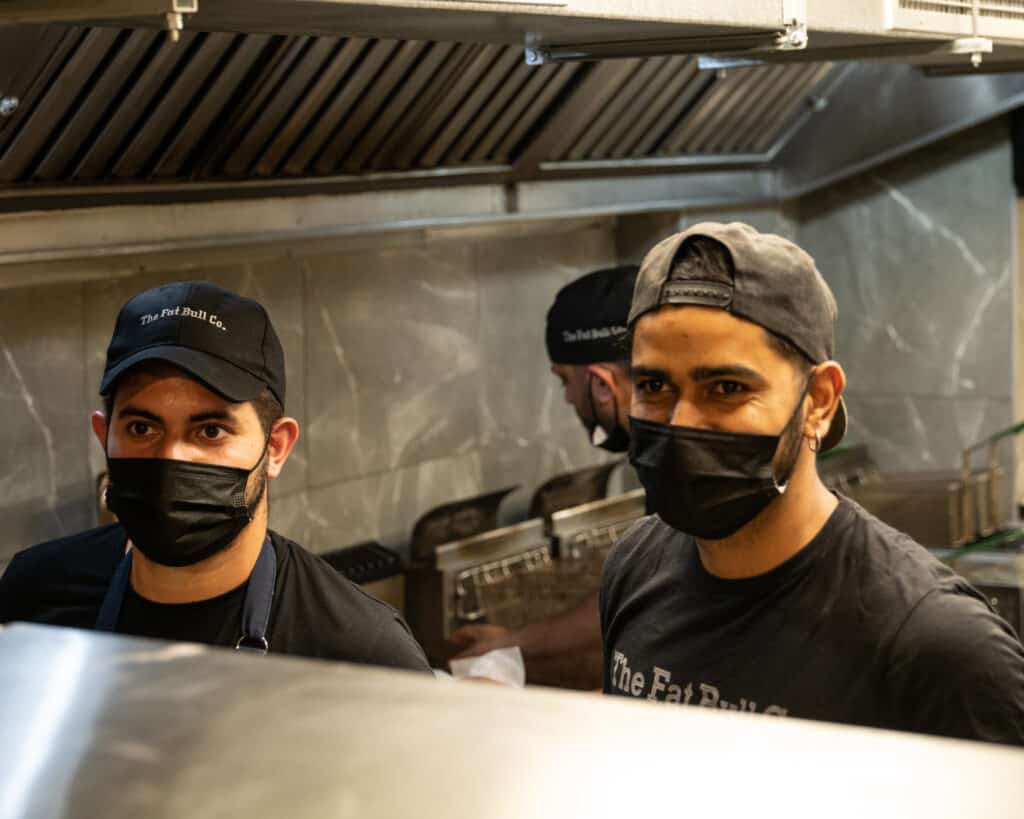 The Fat Bull Co., staff members, preparing burgers from the Fat Bull Co's trademark Aberdeen Angus Beef.